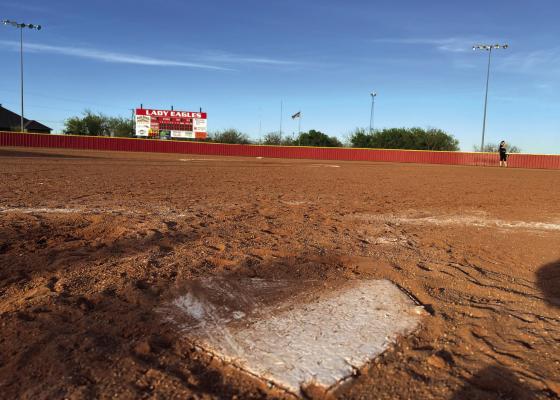 The Holliday Lady Eagles played the final game on its dirt field on Thurs., March 28, picking up a 17-7 win over rival Henrietta. Photo/Will Edwards