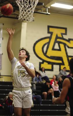 Wildcat guard Seth Truette turns a steal into points on Friday, Jan. 30 against Electra. Photo/Landon Davis