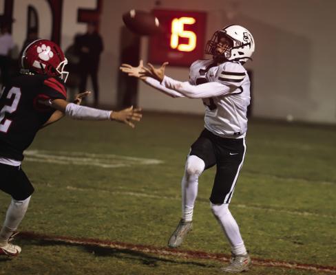 Archer City wideout Cy Wooldridge makes a grab in the rain against the Electra Tigers on Friday, Oct. 24. Photo/Landon Davis