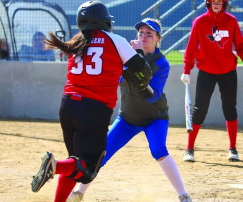 Windthorst’s Keaira Fillingim applies the tag for a double play in the Trojanettes 12-0 win over Electra on Thurs., Feb. 23. Photo/Will
