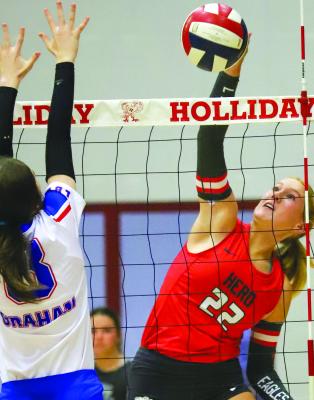 Holliday sophomore Jordan Peters puts down one of her five kills in the first set of the Lady Eagles’ 3-1 comeback against Graham on Tues., Aug. 8. Photo/Will Edwards