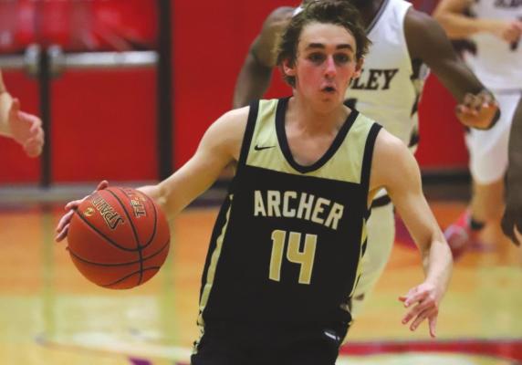 Archer City’s Hunter Sims brings the ball up the court in the second half of the Wildcats’ 66-63 loss to Hawley in the bi-district round. Photo/Will Edwards