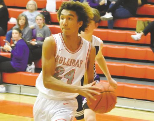 Holliday’s Nathan Williams looks to pass along the baseline in the fourth quarter of the Eagles’ 50-37 win over Jacksboro on Tuesday, Jan. 26. Photo/Will Edwards