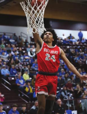 Holliday’s Nathan Williams breaks away for a dunk in the opening minute of the Eagles’ 54-40 loss to Brock on Tuesday, March 1, in Bridgeport. Photo/Will Edwards