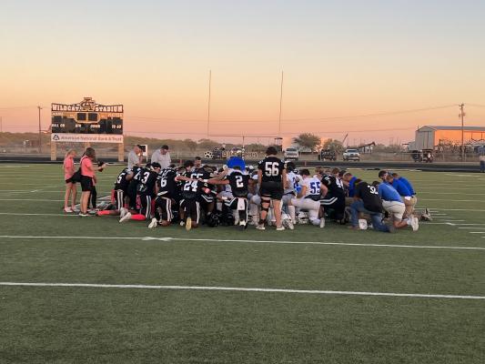 The WindthorsPrior to the Windthorst-Archer City football game, the two teams and community joined in prayer for the family of the victim of a fatal wreck on Friday, Oct. 20. Photo/Will Edwards