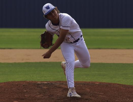 Trojan lefty Conner Schreiber tosses a pitch against Archer City on Tuesday, April 1. The junior finished the day with 12 strikeouts on 69 total pitches. Photo/Landon Davis