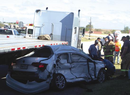 A two-vehicle wreck between an 18-wheeler and a white sedan occured at the intersection of U.S. 281 and Hwy. 25 in Windthorst on the morning of Wednesday, Nov. 2. Windthorst VFD, Archer City AMR, Archer County Sheriff's Office and the Texas Department of Public Safety responded to the scene. The driver of the sedan denied transport to the hospital. Photo/Nathan Lawson
