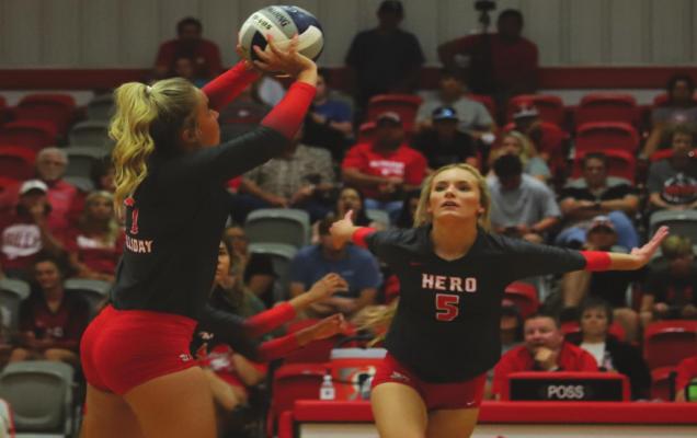 Holliday’s Belle Welch sets the ball for Payton Murray in the fourth set of the Lady Eagles’ 3-1 win over Brock on Tuesday, Aug. 10. Photo/Will Edwards