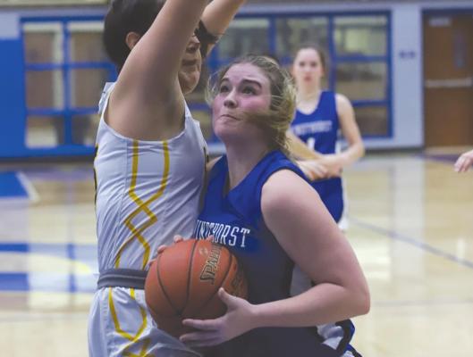 Windthorst’s Tara Tackett drives the lane in the first half of the Trojanettes 45-32 loss to Cisco in the bi-district round on Monday, Feb. 14 in Brock. Photo/Will Edwards