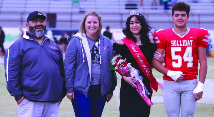 Holliday Band Sweetheart Emi Perez along with her parents and escort Nathan Mangual during the pregame ceremony on Friday, Oct. 7. Photo/Nathan Lawson