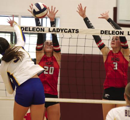 Junior Bennett Luig and Sophomore Emma Ellis brace for a block in the Lady Eagle’s area volleyball matchup against the Blanco Lady Panthers on Saturday, Nov. 9. Photo/Landon Davis