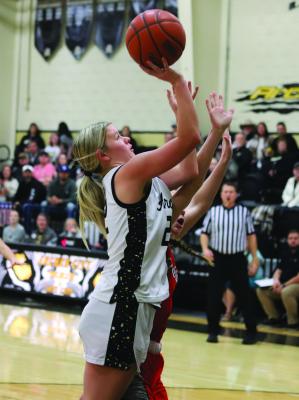 Lady Cat junior Addy Peters makes a layup in Archer City’s 39-30 home district win over Petrolia. Photo/Landon Davis