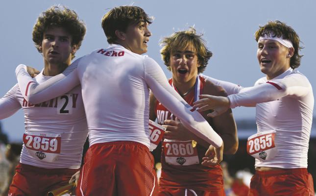 Holliday track members Steele Skinner (left), Ty Harrison (middle), Noah Strohman (middle), and Vaughn Hamill (right) celebrate Skinner's come from behind victory to secure a gold medal for the Eagles 4 x 400 relay team on Thursday, May 1. Photo/Micah McCartney, Wise County Messenger