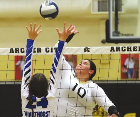 TOP: Archer City senior Bailey Grant put down a season-high 21 kills as the Lady Cats completed the season-sweep of Windthorst behind a 3-1 win on Tuesday, Oct. 19.
