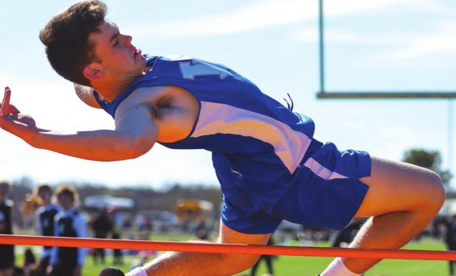 Windthorst’s Brock Hudman clears the bar in high jump en-route to a ninth place finish, jumping 5’ at the Wildcat Relays in Archer City on Thursday, March 31. Photo/Will Edwards