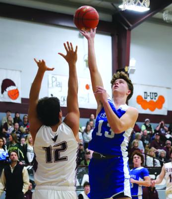 Sophomore Brodie Belz lays in a basket against Seymour. Belz finished the night with seven points. Photo/Landon Davis