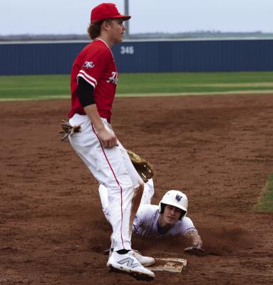 Windthorst's Tanner Doyal slides into third base against the Holliday Eagles during the Windthorst tournament last weekened. Photo/Landon Davis