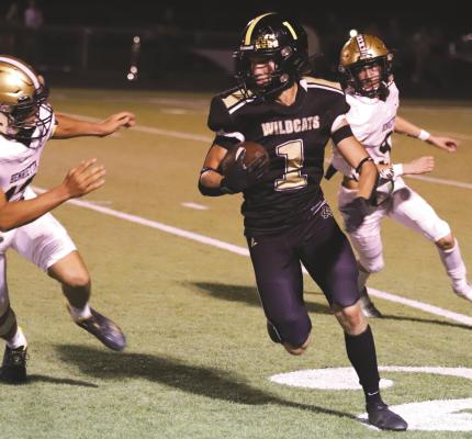 Archer City’s McKinnen Beaver makes a move to the outside in the second half of the Wildcats’ 42-7 homecoming loss to Henrietta on Friday, Sept. 16. Photo/Jerry Phillips