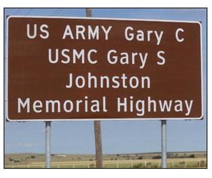 The US Army Staff Sgt. Gary C. Johnston and U.S. Marine Gary S. Johnston Memorial Highway signs were unveiled on Memorial Day. Photo/Nathan Lawson
