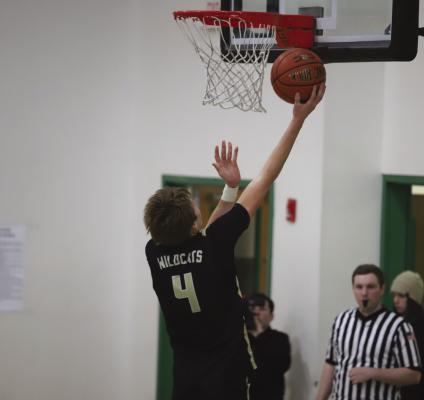 Archer City's Chance Warren goes up for a layup against Iowa Park on Tuesday, Dec. 12. The Wildcats fell 52-51 to the 3A Hawks. Courtesy photo