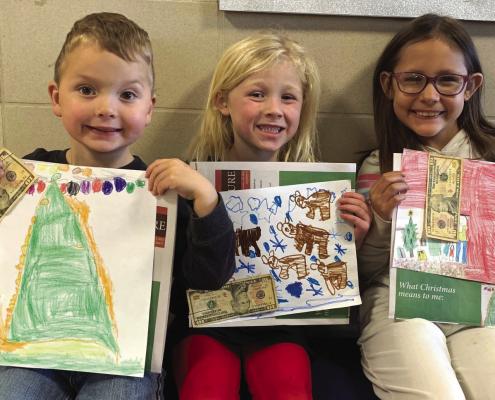 Windthorst Elementary had three winners in the 'What Christmas means to me' drawing contest. Their drawings were featured on the front of the Christmas special edition last week and each winner also got $10 . L-R: Pre-K winner Grayson Hobbs, Kindergarten winner McCrae M., 2nd grade winner Bexley Barron Courtesy photo
