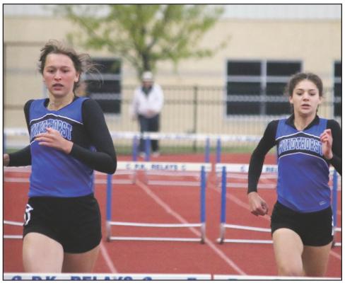 Windthorst’s Annikah Frank (left) and Saige Anderson (right) both advanced to the regional track meet in the 300 meter hurdles. Photo/Jerry Phillps