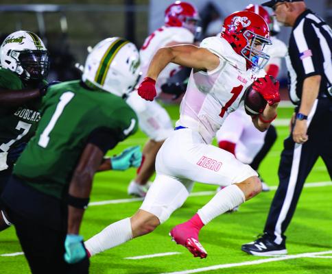 Eagle running back Brayden Hamill blazes by defenders for a 65-yard rushing touchdown against the Bobcats on Friday. Courtesy photo/Jim Harrison