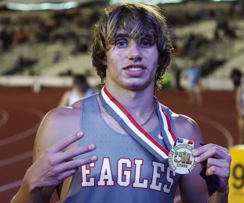 Holliday Sophomore Noah Strohman poses with his 1600M gold medal. It was his third of the day earning him Athlete of the Meet honors at the state meet. File photo