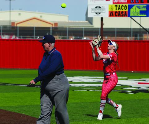 Holliday junior Sammi Kirkland sits under a pop fly in the Lady Eagles’ game against West Plains on Friday, Feb. 27. Photo/Landon Davis