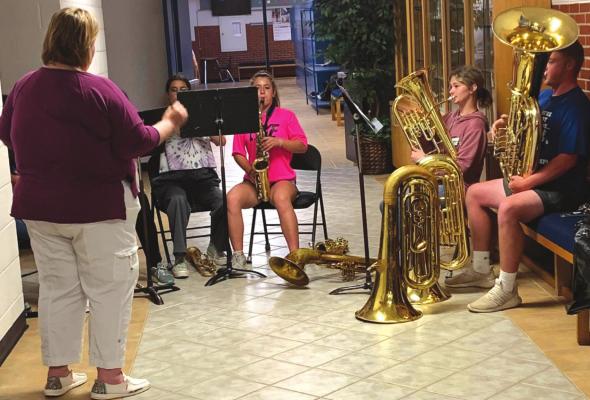 Members of the Windthorst ISD band demonstrate the difference between the old instruments and new instruments purchased by the school board during its meeting April 11. Photo/Nathan Lawson