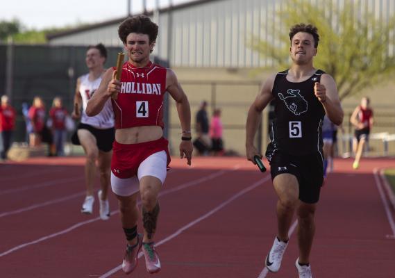 Holliday senior Steele Skinner guts it out towards the finish line in the 4x400 relay at the Area track meet in Graham on Thursday, April 10. The Eagles won the relay by .07 seconds.