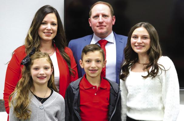 The Holliday ISD School Board named Alice AD Kyle Atwood as the Eagles next head football coach and AD during a board meeting on Wednesday, Jan. 25. Atwood is pictured with his wife, Ashley, and children Payton, Keegan and Kenli Photo/Will Edwards