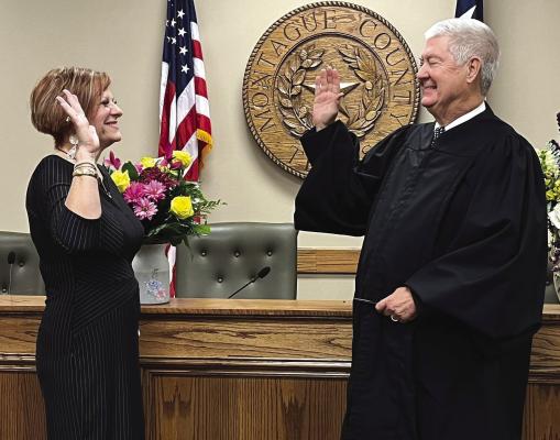 Tracey Jennings is sworn as associate judge for 8th administrative judicial district on Aug. 29 by 97th district judge Jack McGaughey in Montague County for a four year term. She will be handling child support cases from the office of the Attorney General. Courtesy photo