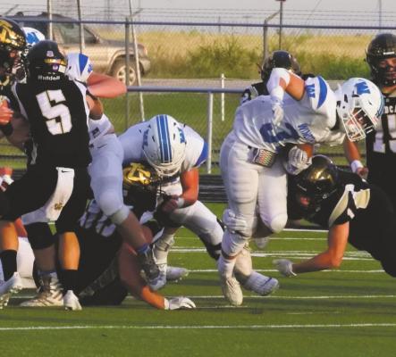 Windthorst running back Ethan Belcher pushes past the line of scrimmage against county rival Archer City on Friday, Sept. 11. Belcher rushed for 232 yards and two touchdowns. Photo/Will Edwards