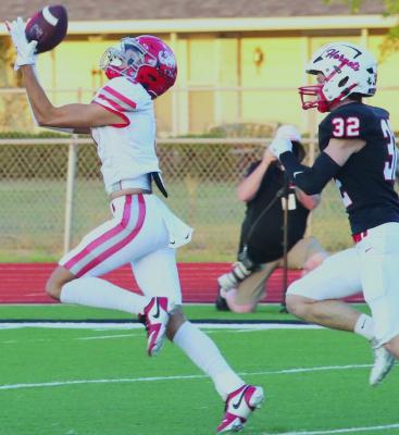 Eagle wideout Ty Harrison reels in one of his two touchdown receptions in Holliday’s 49-35 victory over the Muenster Hornets on Thursday, Sept. 5. The junior receiver finished the game with five catches for 139 receiving yards. Photo/Landon Davis