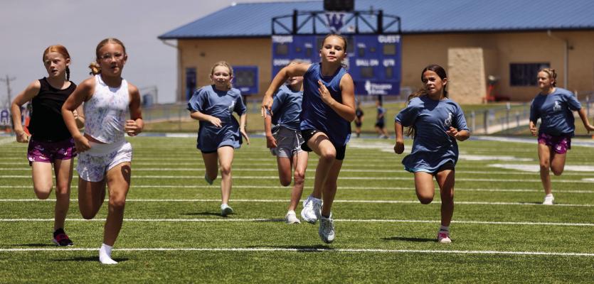The nine and 10-year-old girls race to the finish during the Dairy Derby Children's Races as part of the St. Mary's Parish Picinic. Courtesy photo/Kenda Schroeder Wolf