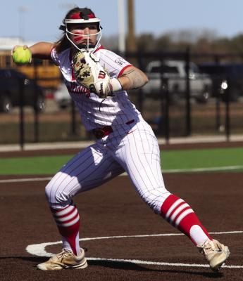 Holliday starting pitcher Carly Duggins makes the throw to first against the Lady Hawks. Photo/Landon Davis