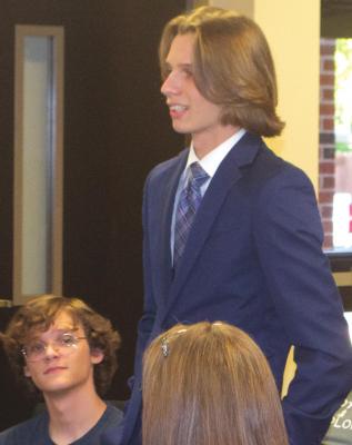 Archer City ISD student Robert Saylers speaks to the school board about the district's grooming and dress codes regarding male hair length. Photo/Nathan Lawson