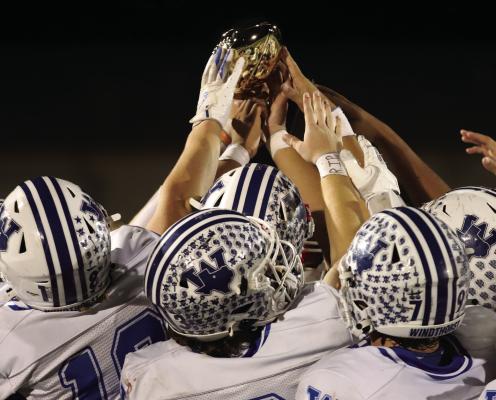 The Windthorst Trojans hoist the District 6-2A trophy following their 64-22 win over Petrolia on Friday, Nov. 7. Photo/Landon Davis
