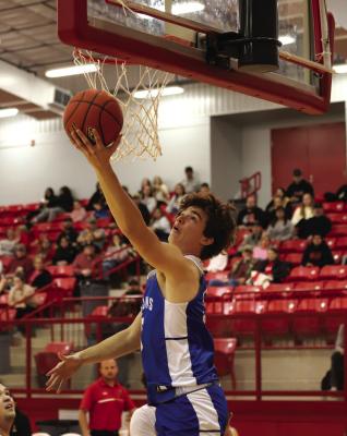 Trojan trio score 16 in win