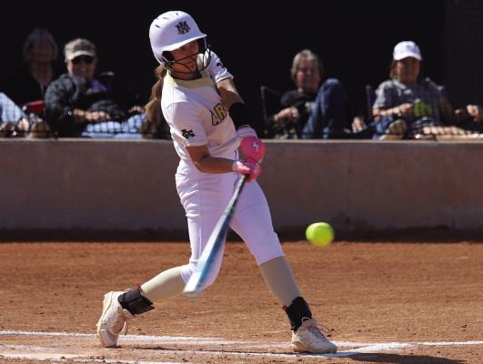 Sophomore Addi Canada slams a pitch for a two-run home run in the Lady Cats’ 12-2 win over Seymour on Monday, April 7. Photo/Landon Davis