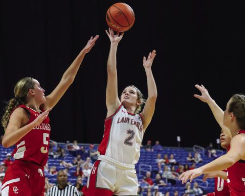 Carissa Griffin gets a shot attempt over a defender in the first half of the Lady Eagles’ 59-40 win over Columbus in the state semifinals on Thurs., March 2. Photo/Will Edwards