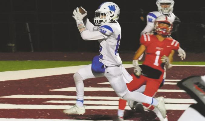 Max Owen celebrates after scoring a touchdown on a 20-yard pass from Cy Belcher in the second quarter of Windthorst’s 30-20 win over Muenster in the Region II-2A DII Regional Finals in Bowie on Thursday, Dec. 3. Photo/Will Edwards