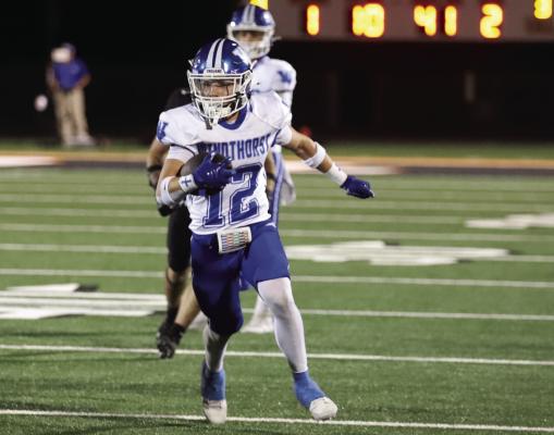 Windthorst Senior Braidan Messineo looks for running room in the Trojans 54-8 district opener win over the Petrolia Pirates on Friday, Sept. 25. Photo/Rolando Medina
