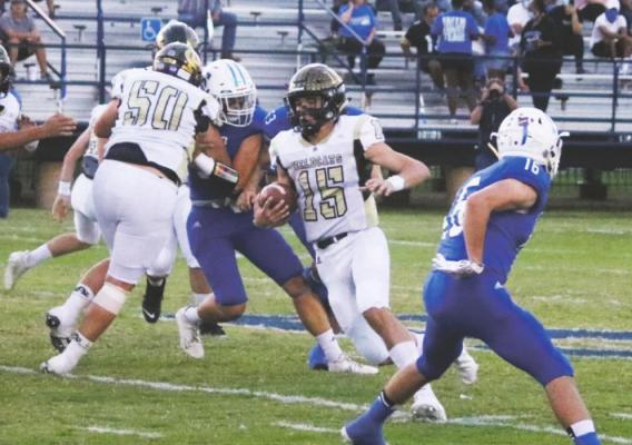 Ty Bates scurries out of the pocket for a gain against Stamford. Photo/Jerry Phillips