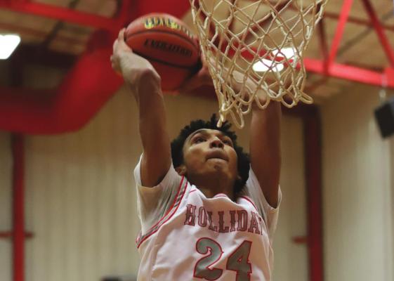 Holliday’s Nathan Williams put the finishing touches on the Eagles’ 48-42 win over Bowie on Friday, Feb. 11, with a massive two-handed slam in the final minute. Photo/Will Edwards