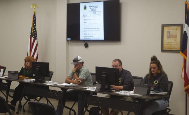 The Lakeside City counil listens to City Administrator John Strenski go over the bid for the dredging of the city's sewer lagoons during its meeting Tuesday, Oct. 18. The council awarded a $200,000 bid to Dredge America. Photo/Nathan Lawson