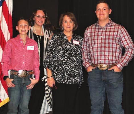 L to R: Wayland Cowley, AC 4-H led the pledge; Cori Cowley, Forum Moderator; Leslie Hash, Archer County Republican Party Chairman, and Mason Gilmore, AC 4-H led the pledge. Photo/Jerry Phiilips