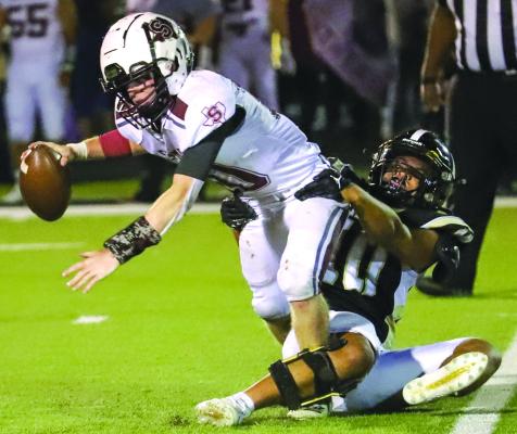 Archer City’s Jre Donnell brings down Seymour quarterback Keegan Gilbreath for one of his five sacks on the night in the Wildcats’ 33-16 win over Seymour on Friday. Photo/Will Edwards