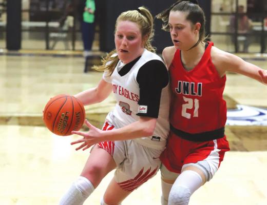 Holliday’s Sarah Cowan drives the lane in the second half of the Lady Eagles’ 59-36 loss to Jim Ned in the area round in Stamford on Friday, Feb. 18. Photo/Willl Edwards